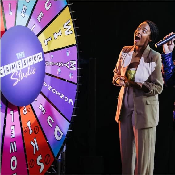 Game Show Studio contestant next to wheel