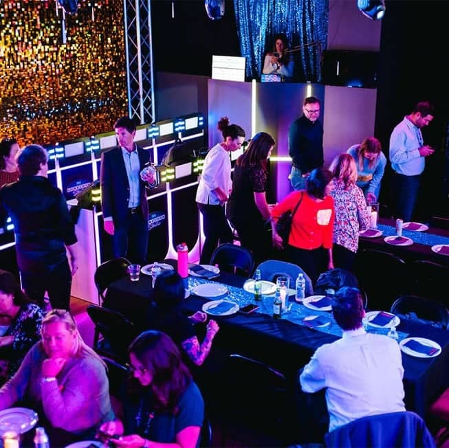 group of employees eating at game show studio before the game
