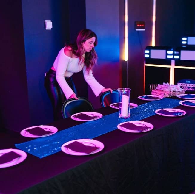 woman setting up catering event for team members