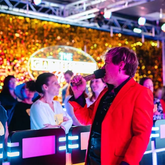 game host talking to contestants