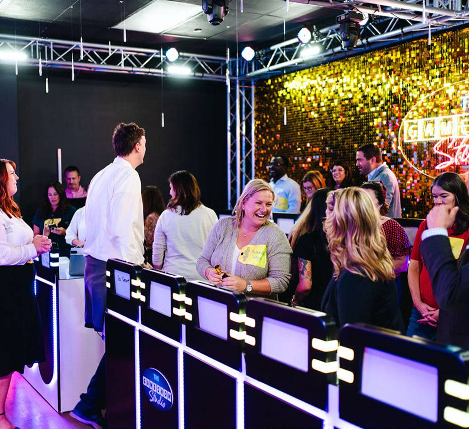 group of friends smiling at game show studio