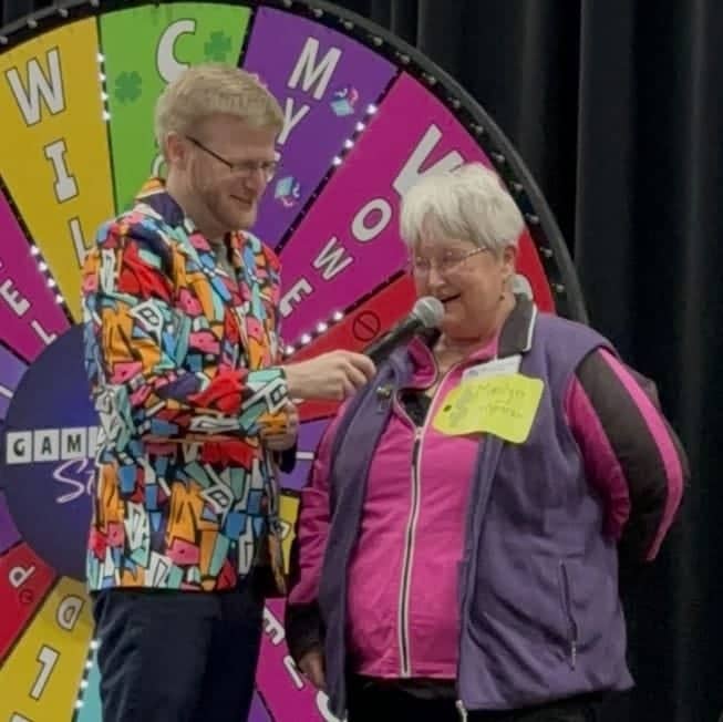 contestant and game show studio host