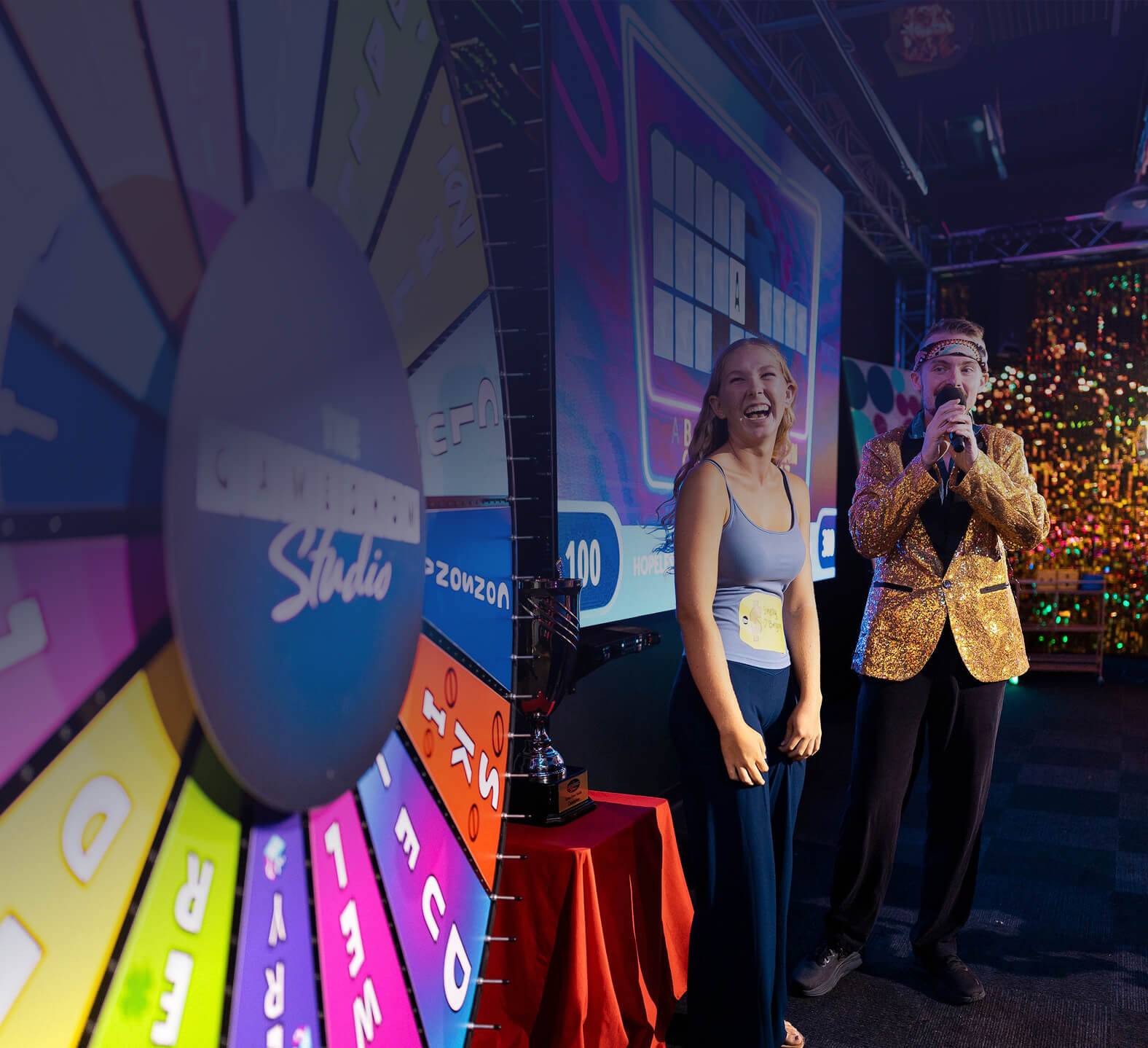 Game Show Studio contestant and host looking at spin wheel