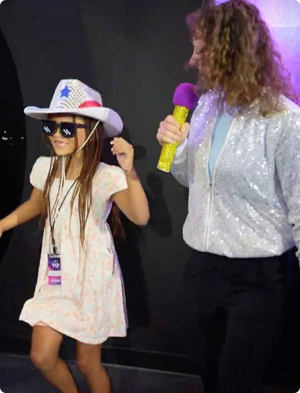 game show studio host and kid contestant