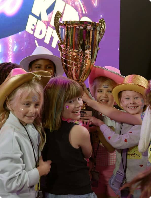 game show studio kids team holding trophy