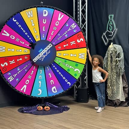 kid spinning game show wheel