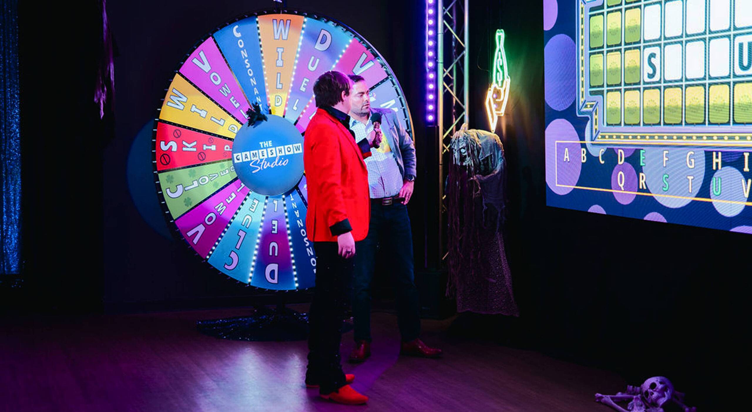 game show studio host asking contestant a question