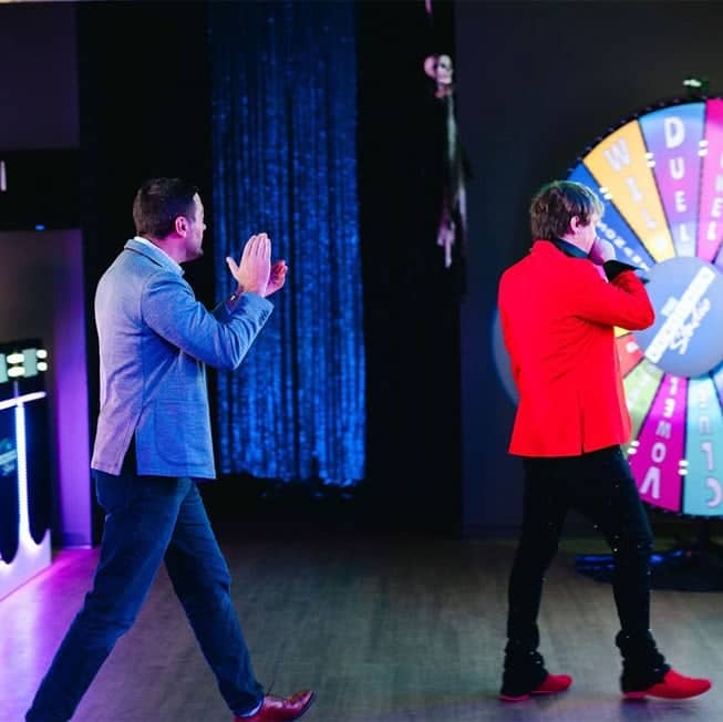 game contestant clapping hands walking up to game