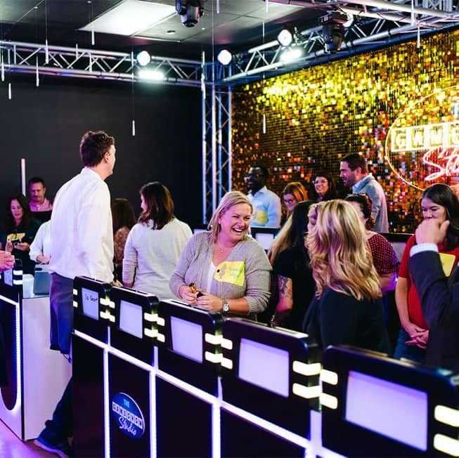 group of friends playing a game at game show studio