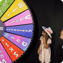 kid next to game show wheel