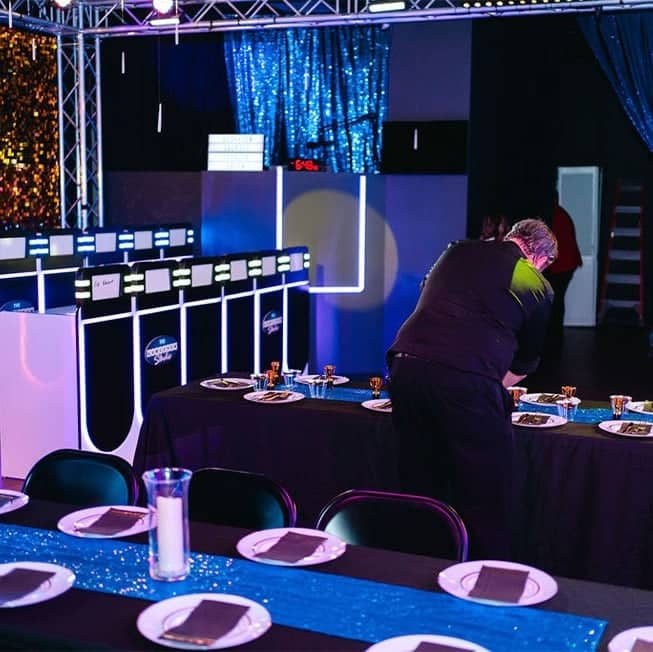 server laying down plates at company event