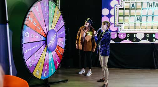 woman spinning wheel of fortune wheel