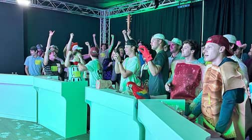 Game Show Studio host asking team for answers to question
