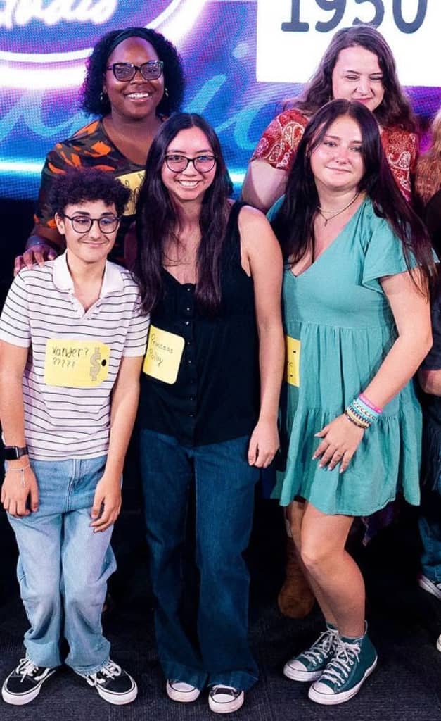 family smiling for portrait