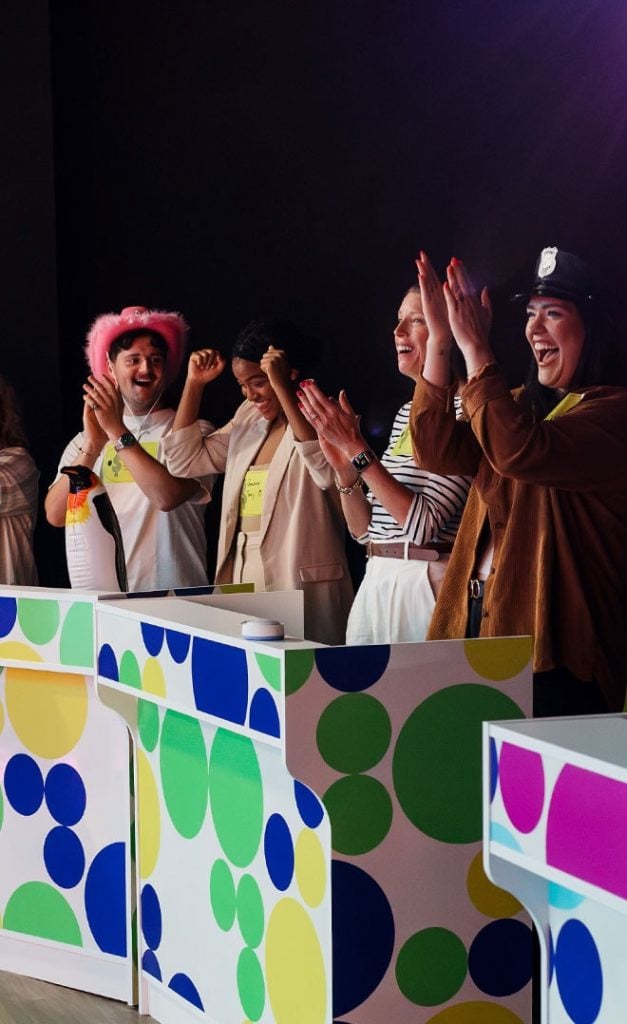 group of family cheering on stage