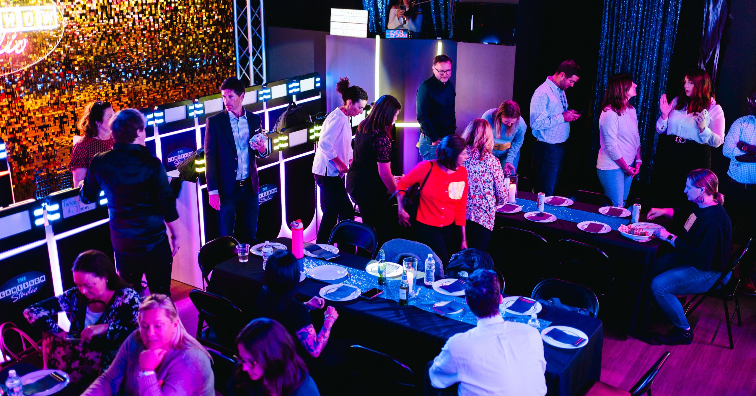 aerial view of contestants eating before game show