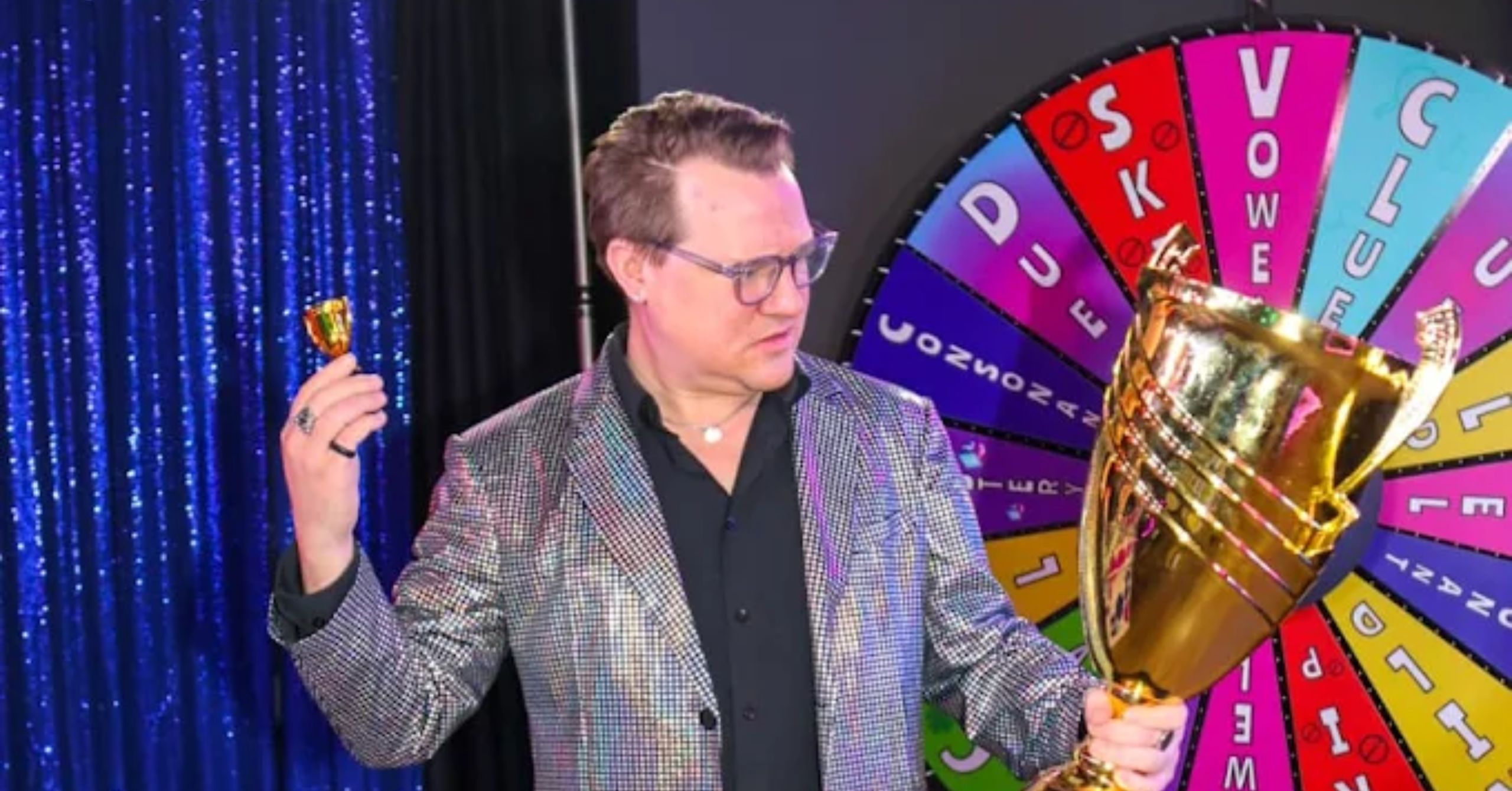 gentleman holding trophy