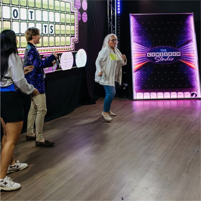 Woman dancing on game show studio stage