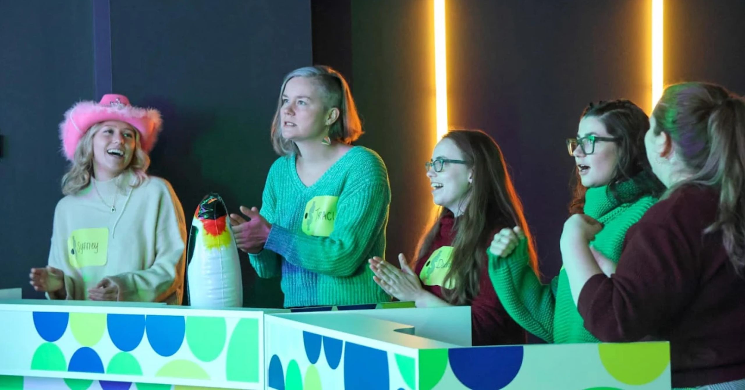 close-up of game contestants clapping