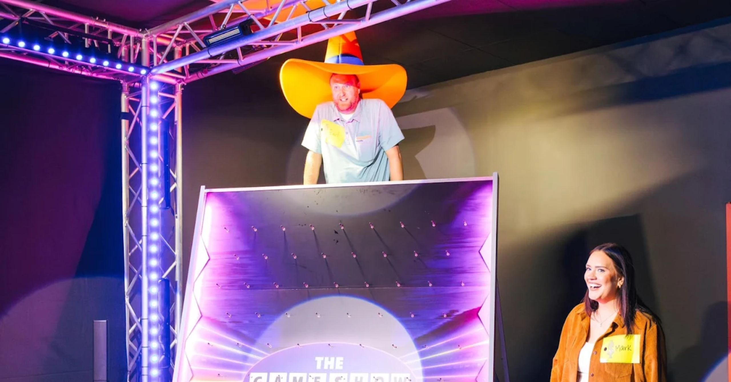 gentleman wearing big orange hat