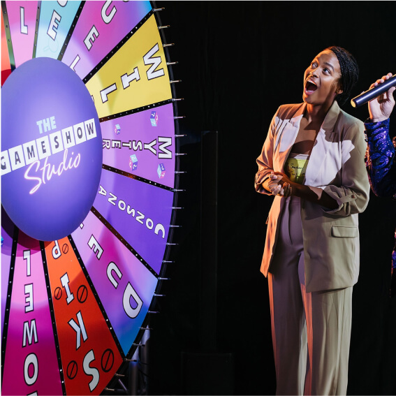 Game Show Studio contestant next to wheel