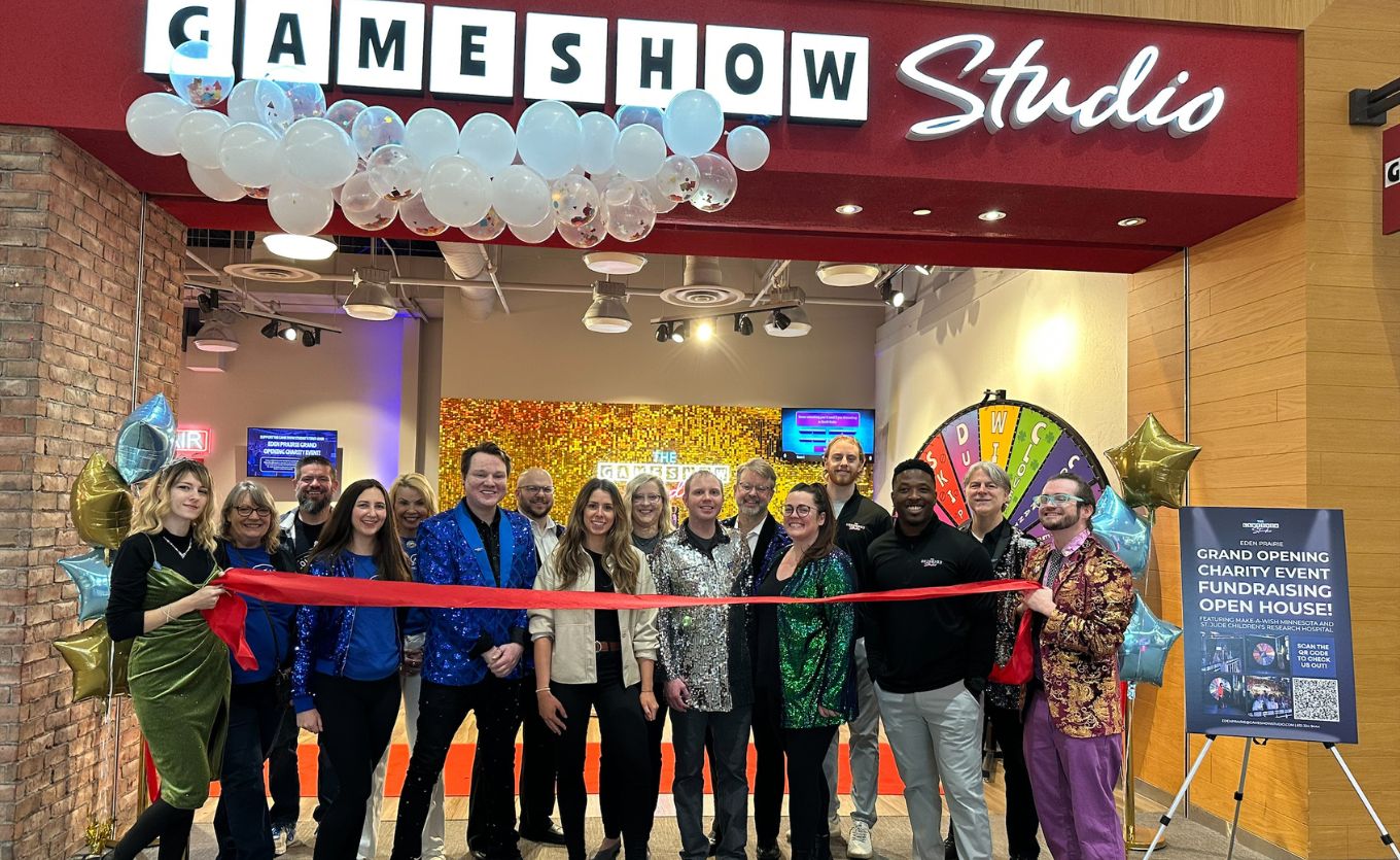 Game Show Studio staff in front of store